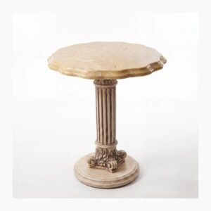 A pale stone pedestal table