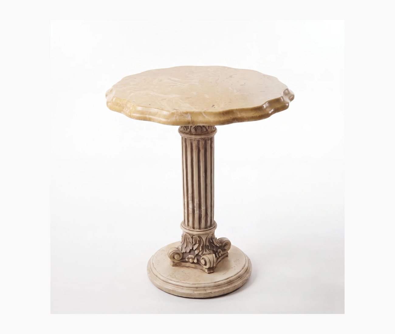 A pale stone pedestal table