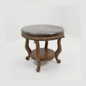 A round marble-topped table on a carved pedestal base